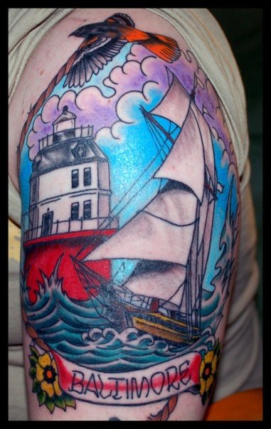 This tattoo of the Baltimore Lighthouse with the Pride of Baltimore sailing 